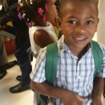 Happy recipient of shoes, backpack and school supplies to the Belle Glade and Pahokee Missions.